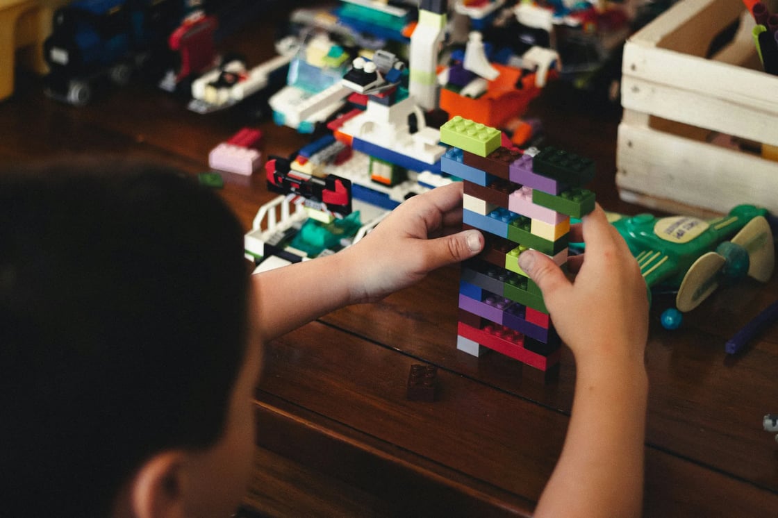 Child exploring a colourful sensory activity